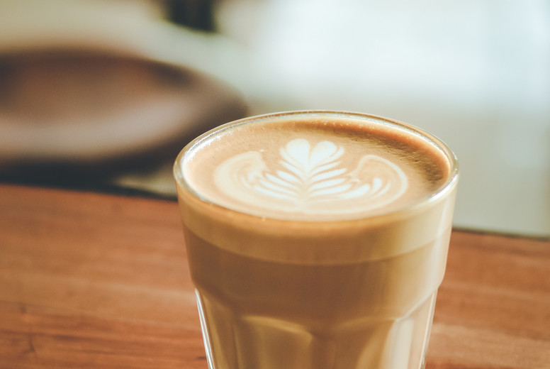 Cup of hot coffee on the table