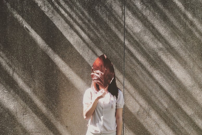 Woman hiding her face