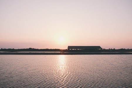 Silhouette of sea salt farm