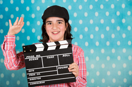Teenage girl with a film clapper