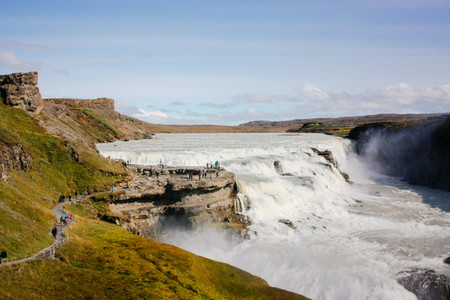 Gullfoss waterfall with people on rocks in Iceland