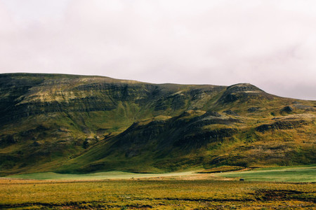 Icelandic landscape of green mountains