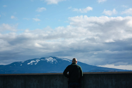 Man looking at Icelandic mountain