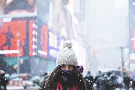 Girl with beanie in blizzard