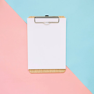 Blank clipboard on pastel color