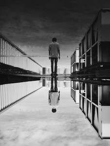 A man standing with reflected