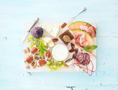 Wine snack set Figs grapes nuts cheese variety meat appetizers and herbs