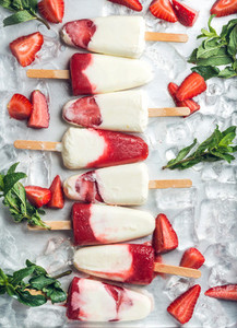 Strawberry yogurt ice cream popsicles with mint