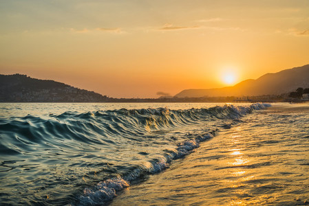 Sunset at the beach in Alanya Turkey View of the castle hill and sea