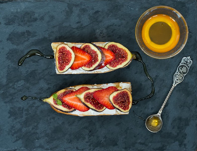 Fig and strawberry goat cheese sandwiches with honey