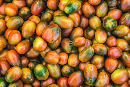Ripe kumato tomatoes on a market stall
