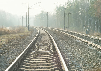 Empty suburban railroad leading to the horizon on a sunny day