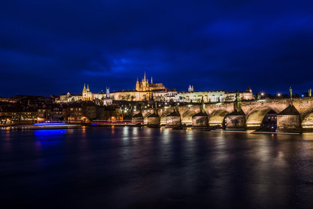 View at night across the Vltava River in Prague with Charles Bri