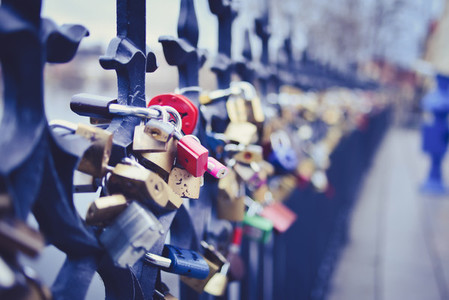 Locks of lovers on the fence on Staromestska side of Vltava near
