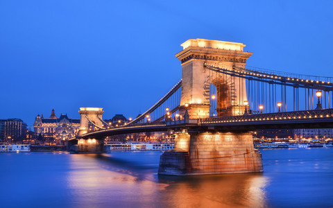 The evening view of the Chain bridge  the Danube and Buda side f