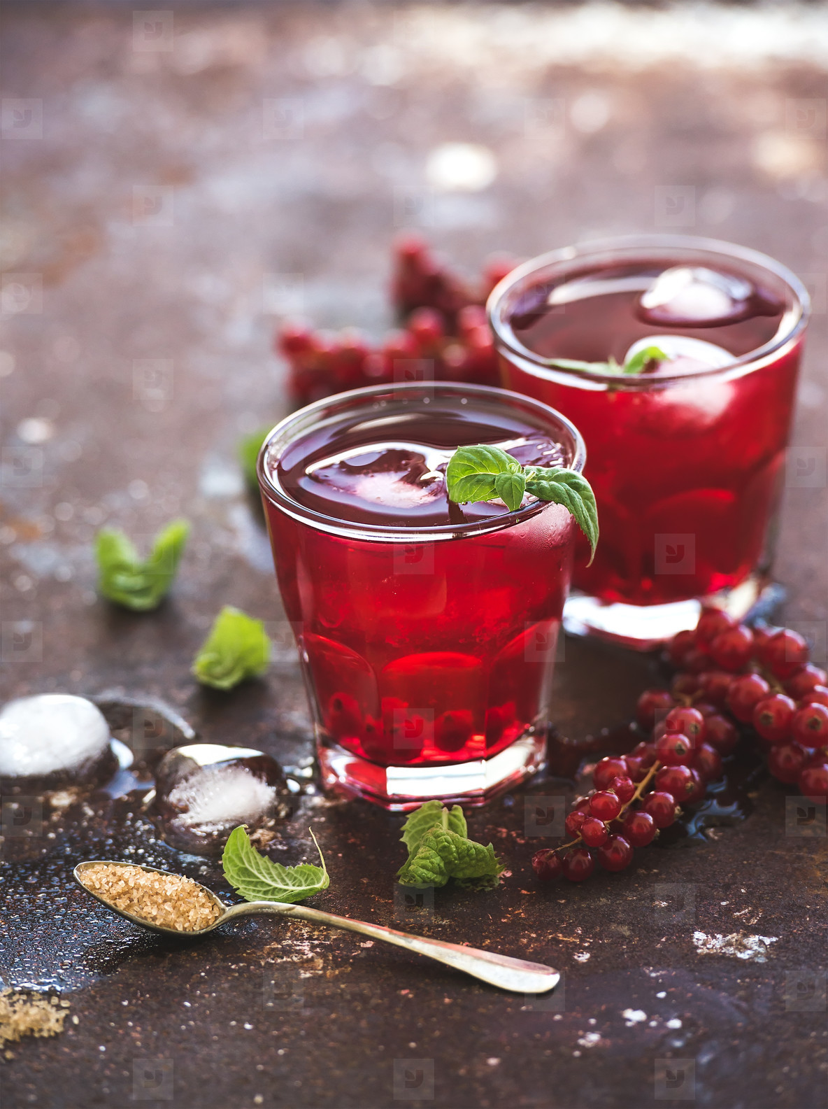 Red berry lemonade with ice and mint on grunge vintage rusty metal backdround