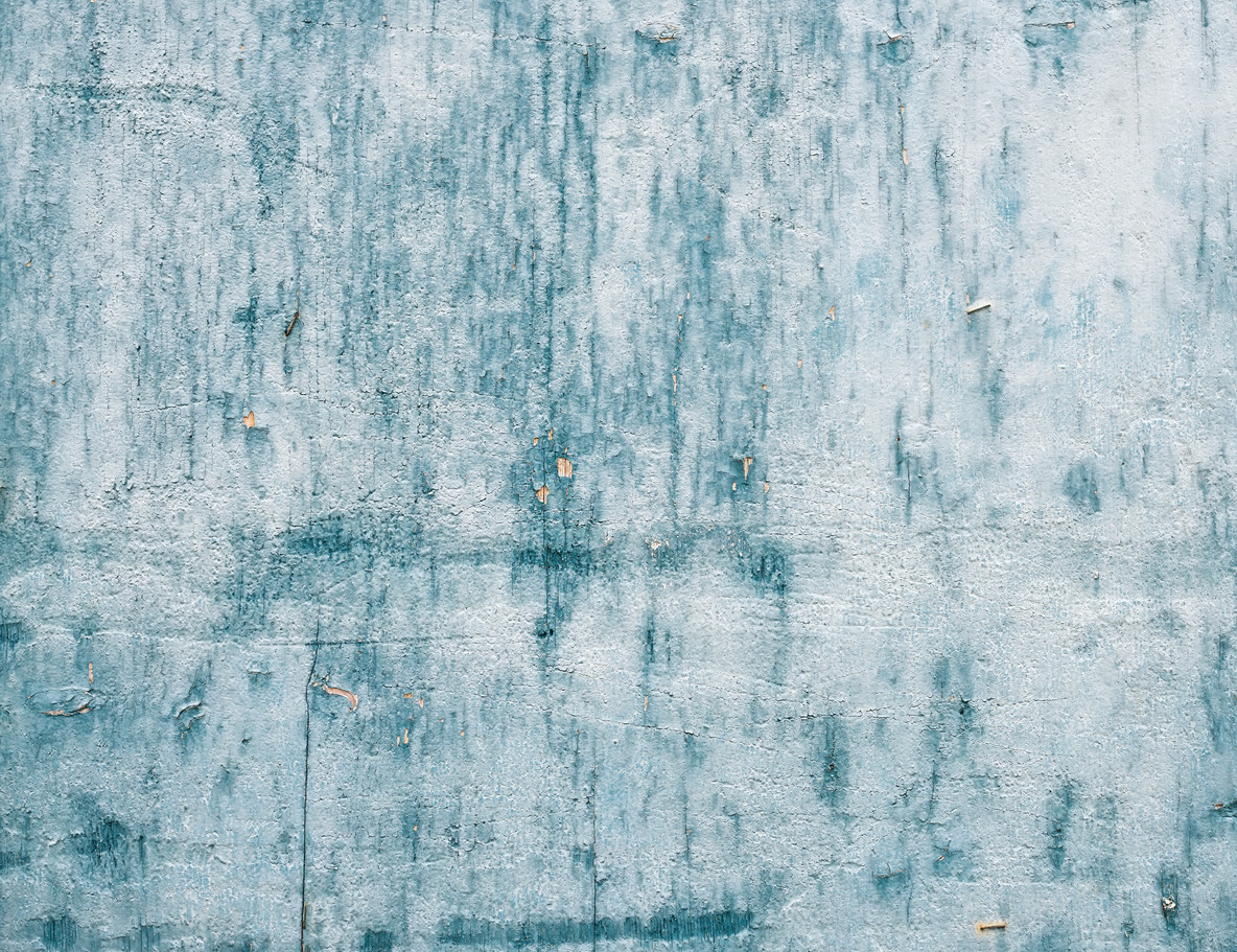 Grunge light blue painted wooden textured background.