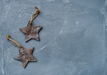 New year or Christmas background and texture  Toy rustic wooden stars over grunge grey surface  top view