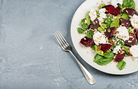 Salad with roasted beetroot  spinach  soft goat cheese and seeds