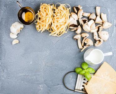Ingredients for cooking pasta with mushrooms and white sauce