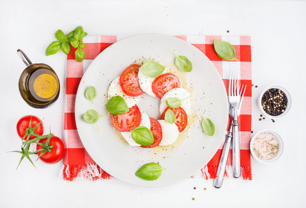 CLassic Italian Caprese salad with tomatoes mozzarella di Buffala and fresh basil