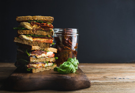 Caprese sandwich or panini Whole grain bread mozzarella cherry and dried tomatoes basil