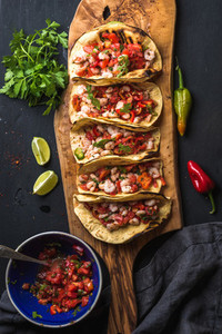 Shrimp tacos with homemade salsa  limes and parsley
