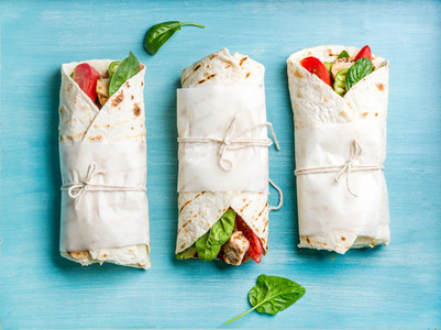 Healthy lunch snack  Tortilla wraps with grilled chicken fillet and fresh vegetables
