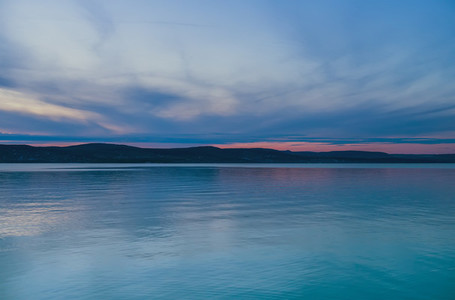 Evening view of the lake and mountains at sunset  blue hour  Balaton  Hungary