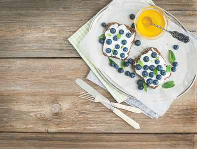 Healthy breakfast set with ricotta  fresh blueberries  honey and
