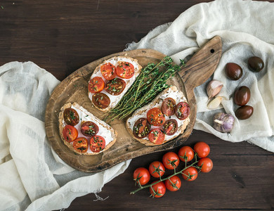 Sandwiches brushtta with roasted cherry tomatoes  soft cheese