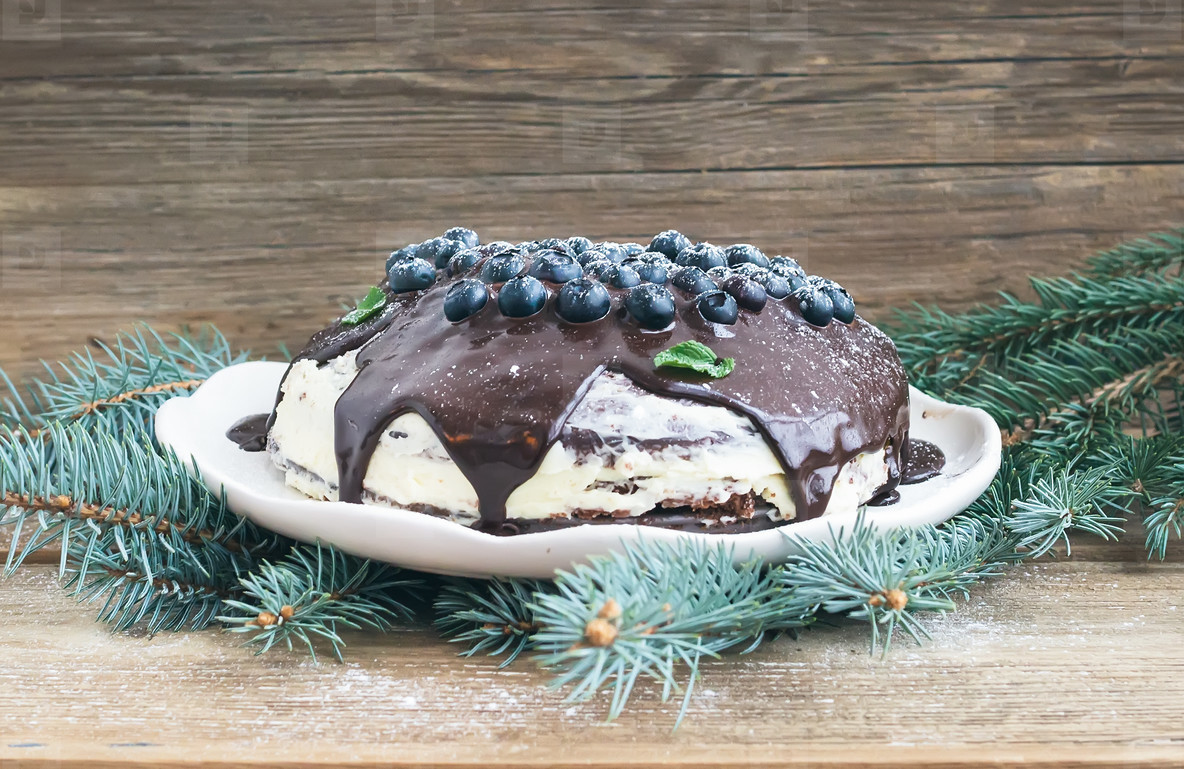 Christmas chocolate cake with chocolate ganache, cream-cheese fi