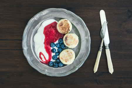 Breakfast set curd pancakes with yogurt  fresh blueberry and ra