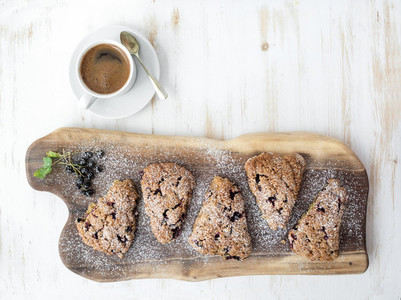 Fresh black currant scones with cup of coffee   top view