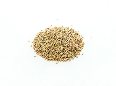 Green raw buckwheat groats on white background