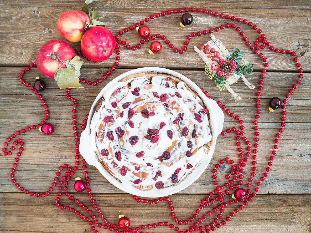 Apple, cranberry and cinnamon roll cake with creamy icing and Ch