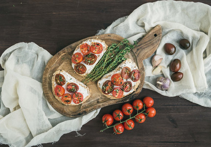 Sandwiches or brushettas with roasted cherry tomatoes  soft cheese