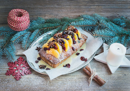 Christmas tangerine and cranberry spicy cake with holiday decora