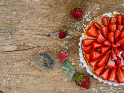 Strawberry cheesecake on a wooden background