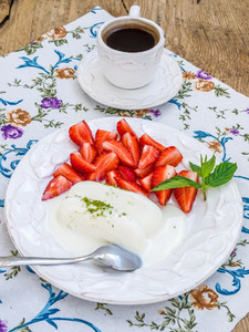 Goat milk ice cream with pistachio and strawberry