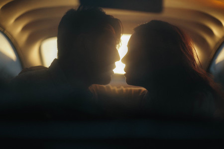 Silhouette of couple in car