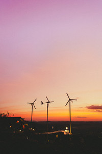 Small wind turbines in sunset