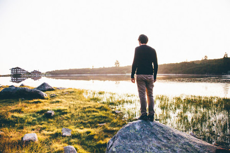 Young man near a lake