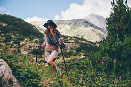 Girl hiking a mountain