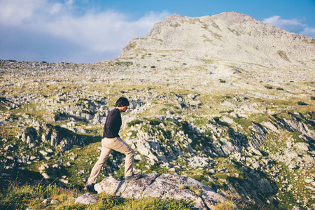 Young man hiking a mountain