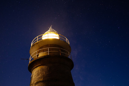night sky and lighthouse