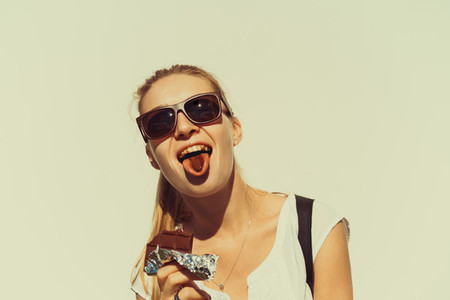 beautiful girl eats chocolate