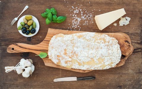 Freshly baked ciabatta bread with garlic mediterranean olives basil and Parmesan cheese