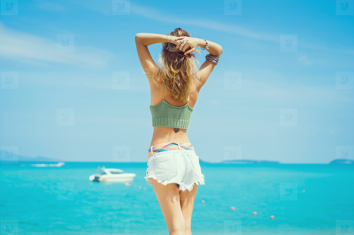 pretty woman posing in the sea