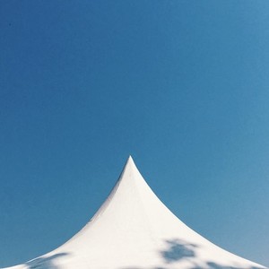 white tent and blue sky